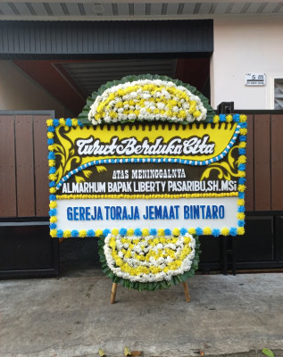 Papan Bunga Duka di Sukajawa